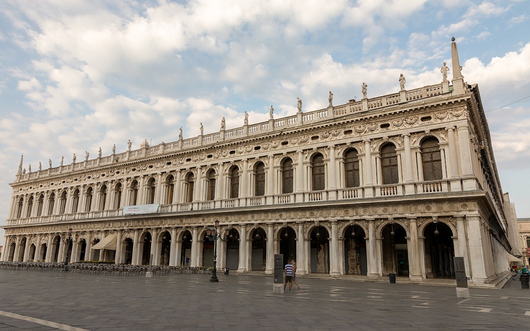 Correr Museum facade in Venice with ornate architecture and statues.