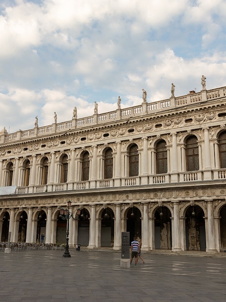 Correr Museum facade in Venice with ornate architecture and statues.