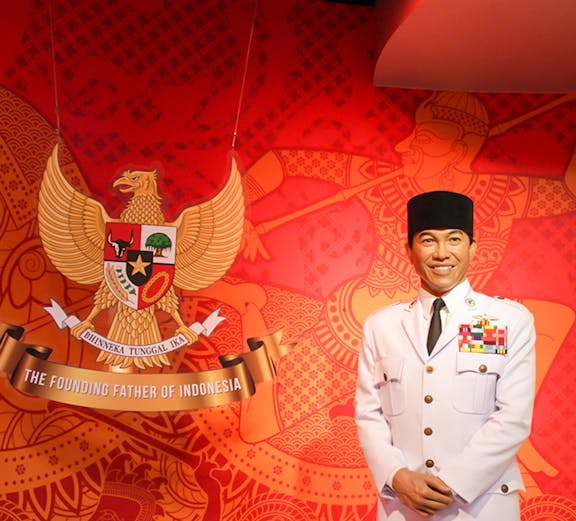 Wax figure in military attire at Madame Tussauds Bangkok with Indonesian emblem.