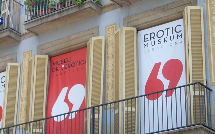 Erotic Museum Barcelona entrance with banners and balcony.