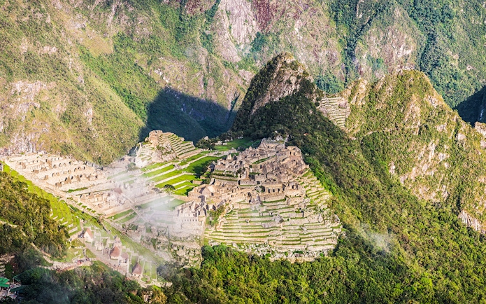 Panoramic view of Machu Picchu ruins from Sun Gate, Peru.