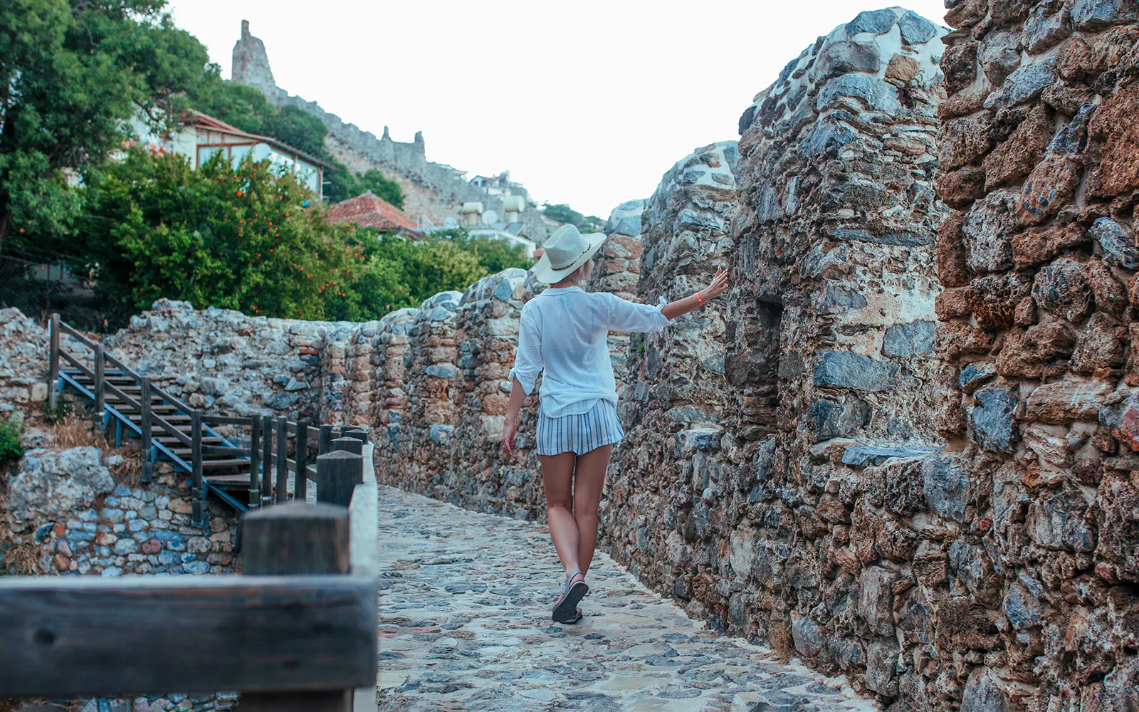 Traveler exploring Alanya castle ruins on a day-trip by jeep.