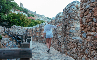 Traveler exploring Alanya castle ruins on a day-trip by jeep.