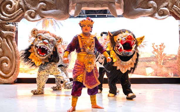 Garuda Wisnu Kencana cultural dance performer with traditional costumes and mythical creatures.