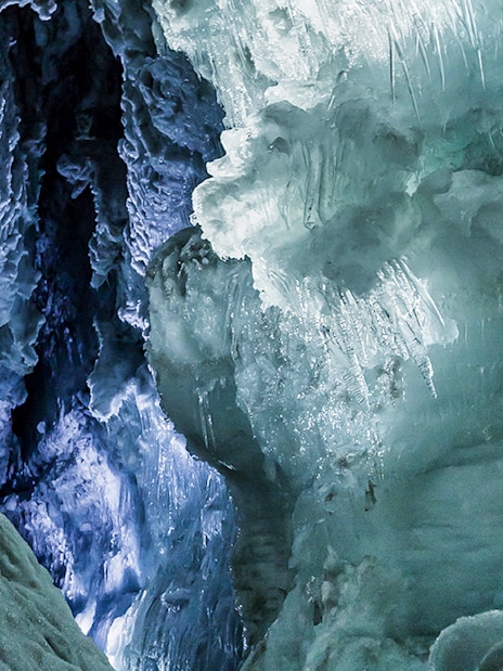 Ice tunnels inside Langjökull Glacier with intricate ice formations.