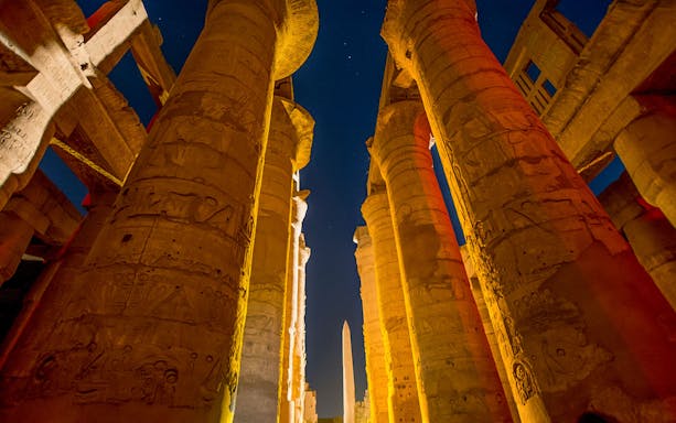 Karnak Temple columns illuminated during Sound and Light show, Luxor, Egypt.