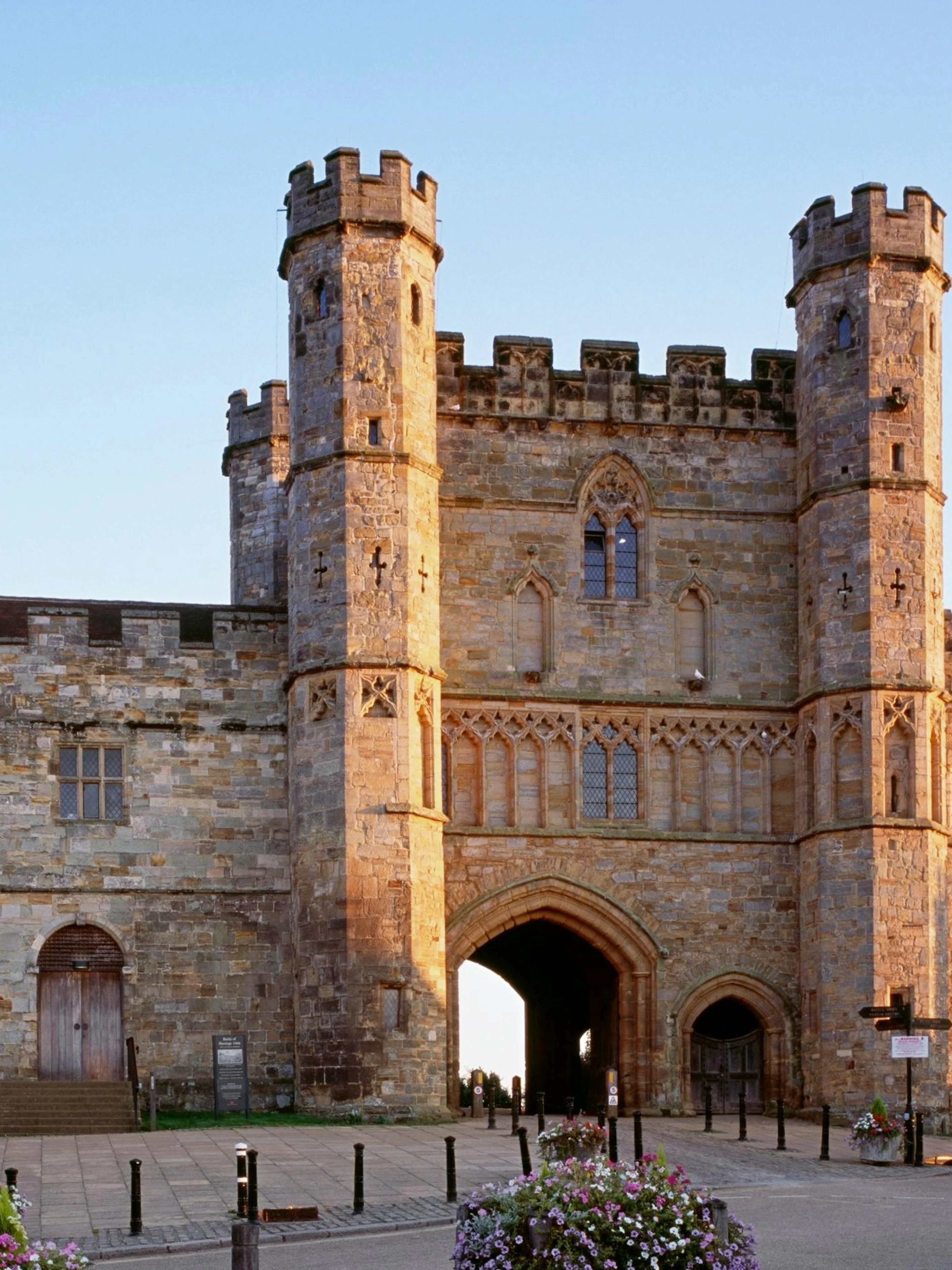 Battle Abbey gatehouse in East Sussex, England, with historic stone architecture.