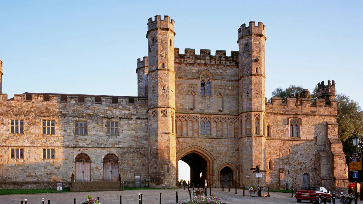 Battle Abbey gatehouse in East Sussex, England, with historic stone architecture.