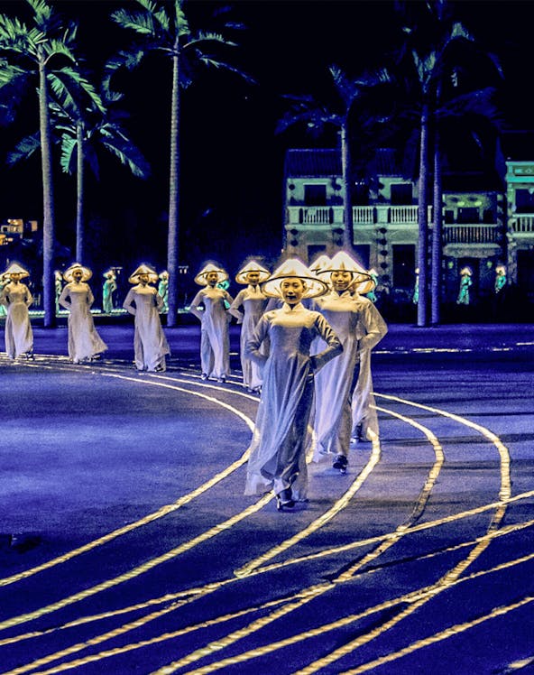 Performers in traditional attire during Hoi An Memories Show, Vietnam.
