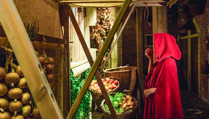 Toll House, with a variety of goods like fruits, vegetables, etc at Historium Bruges.