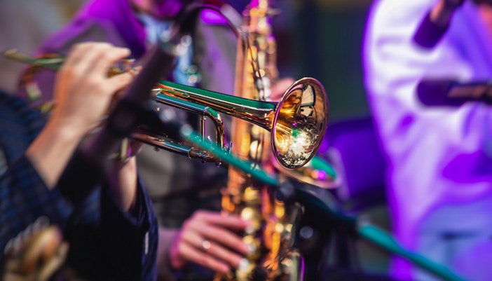Musicians performing at Nice Jazz Festival in France with audience in the background.