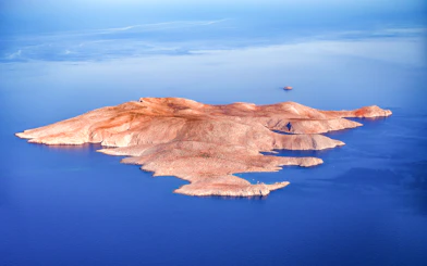 Aerial view of Dia Island surrounded by blue sea, Crete.