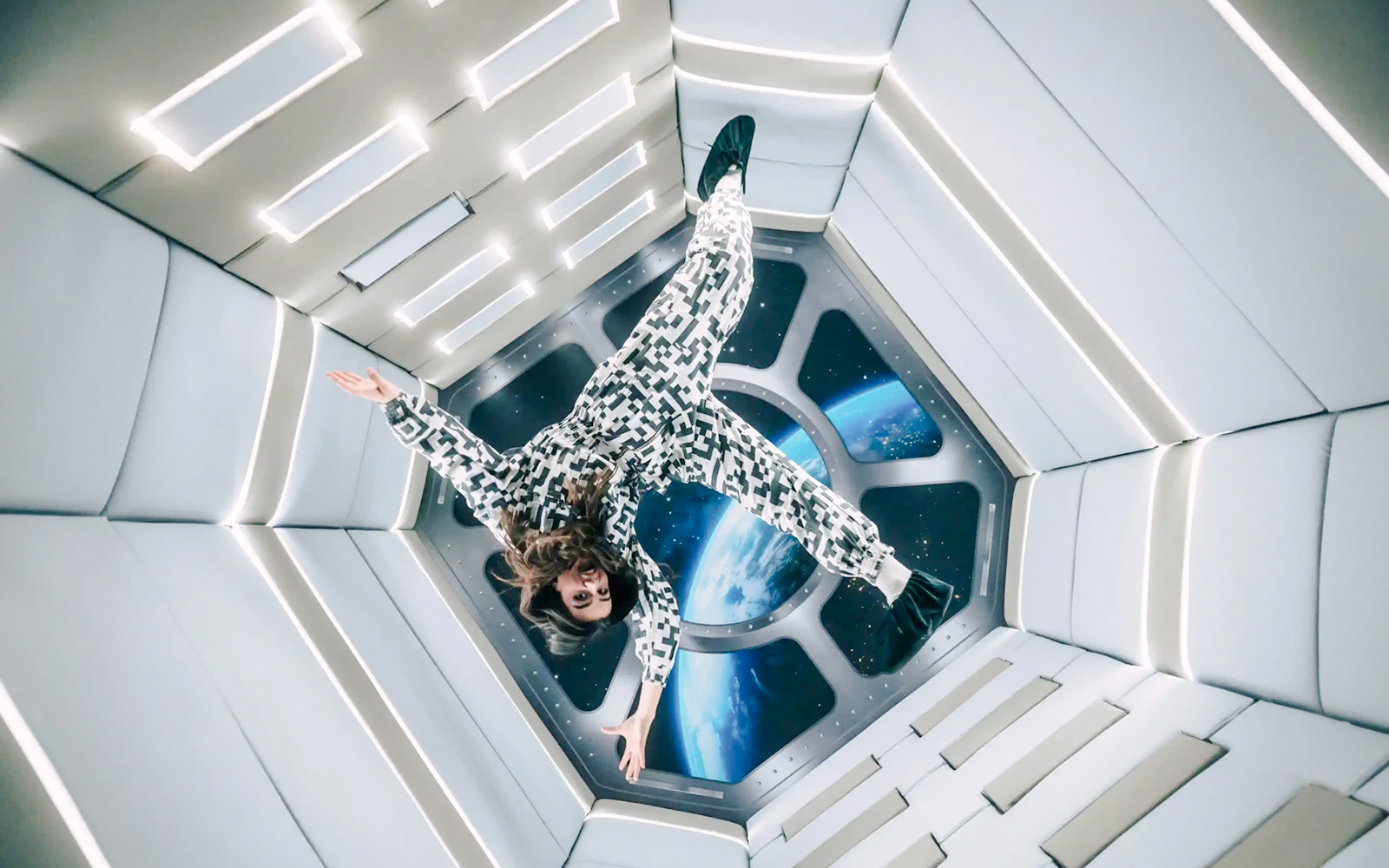 Person floating in Zero Gravity room at Paradox Museum Paris.