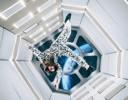 Person floating in Zero Gravity room at Paradox Museum Paris.