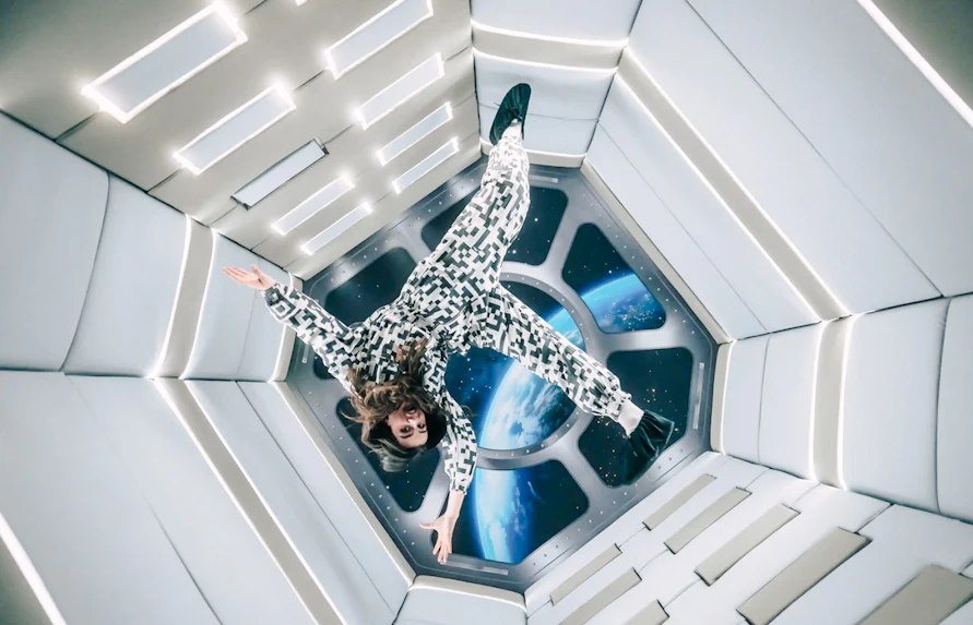 Person floating in Zero Gravity room at Paradox Museum Paris.