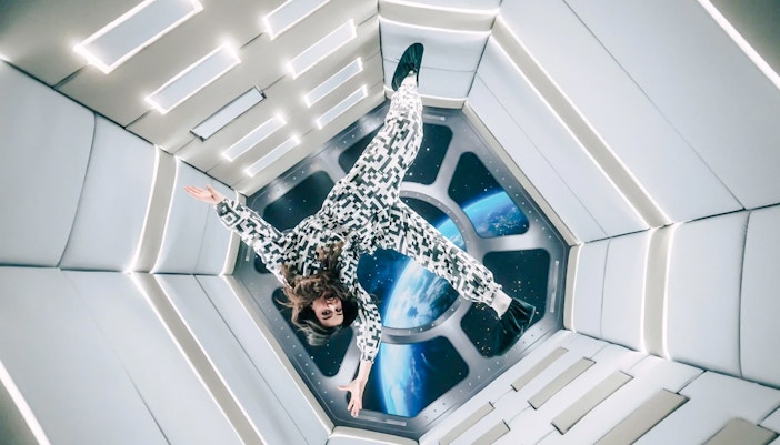 Person floating in Zero Gravity room at Paradox Museum Paris.