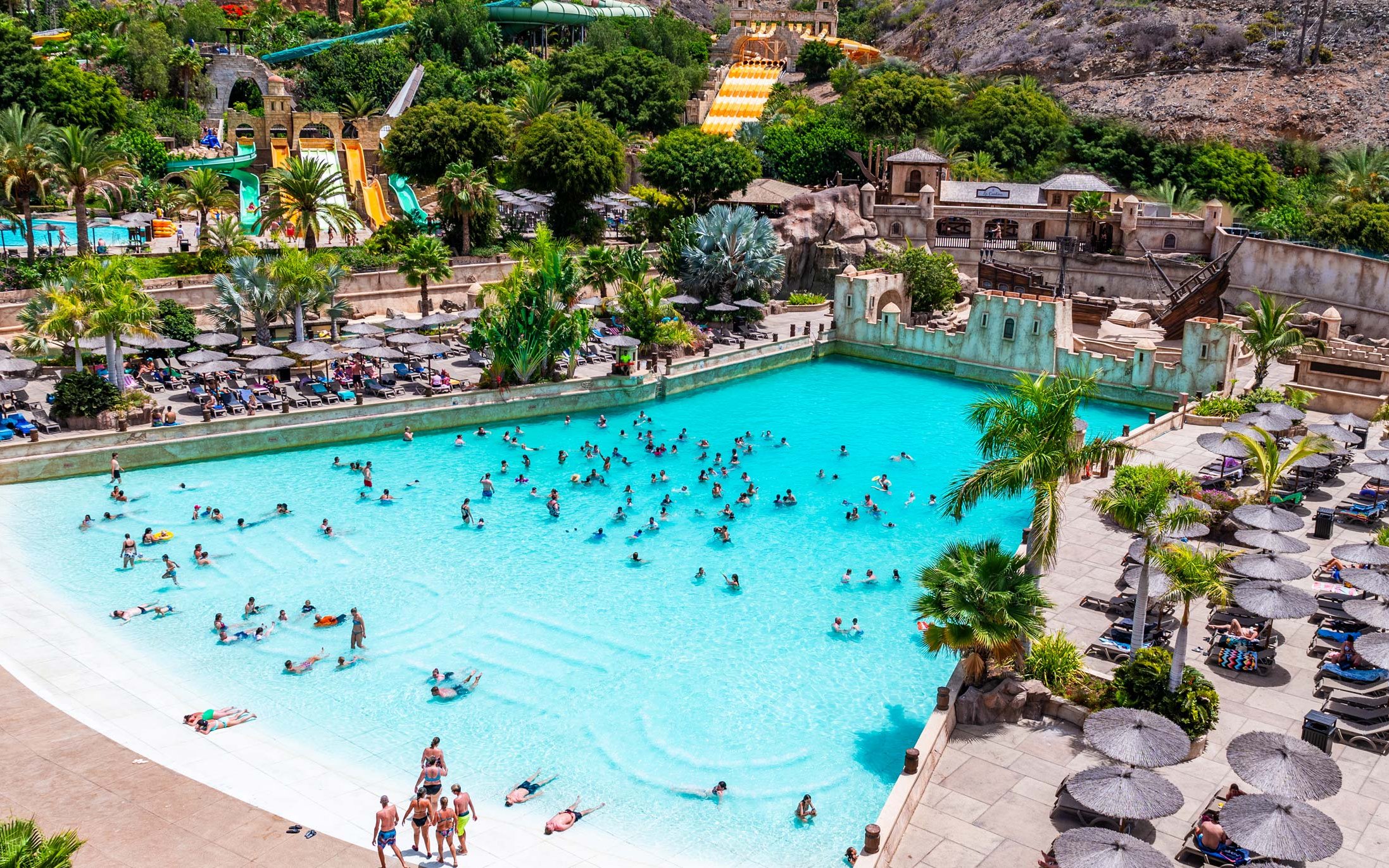 Visitors enjoying the wave pool at Discovery Island, Aqualand Maspalomas.