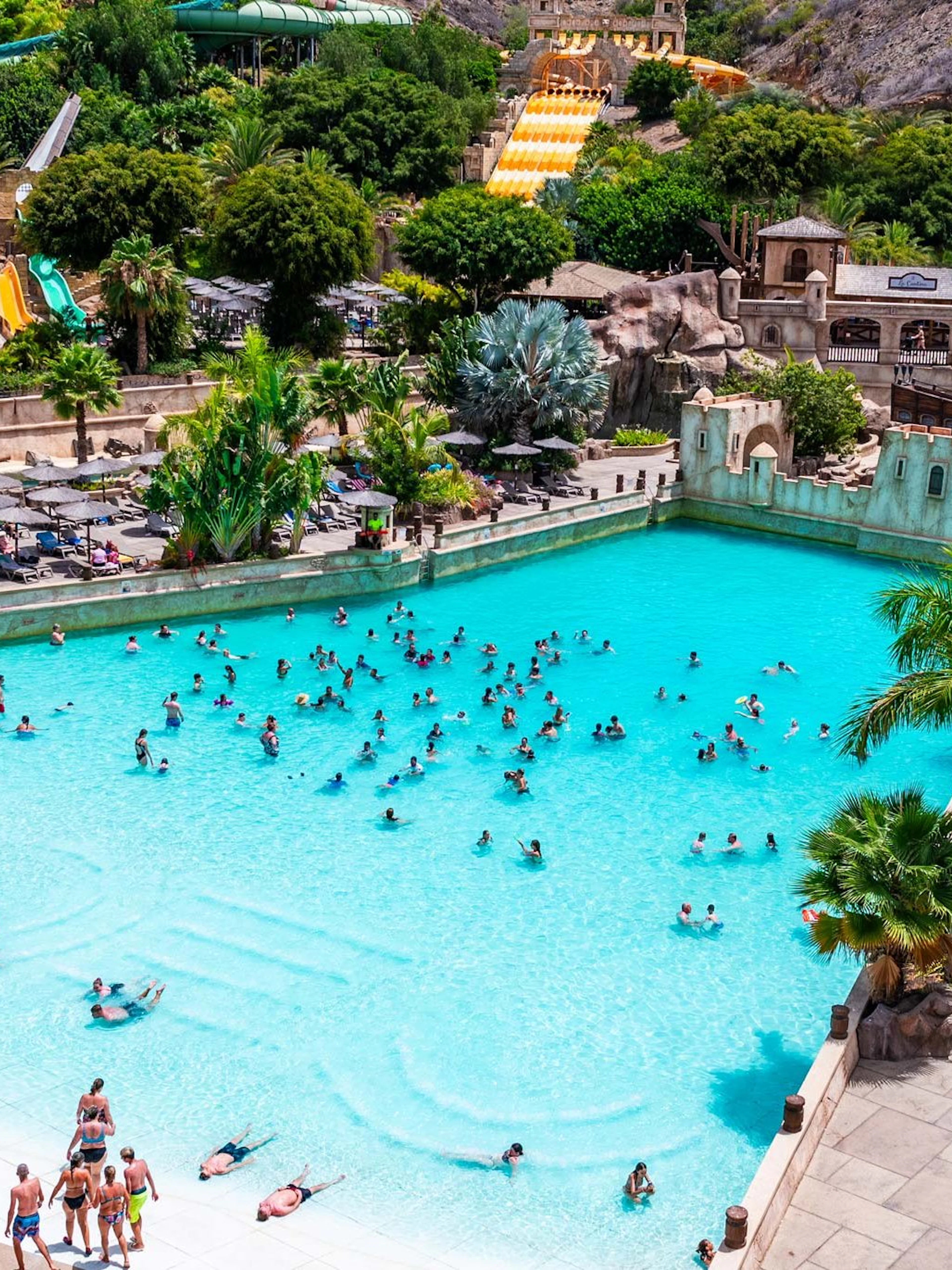 Visitors enjoying the wave pool at Discovery Island, Aqualand Maspalomas.