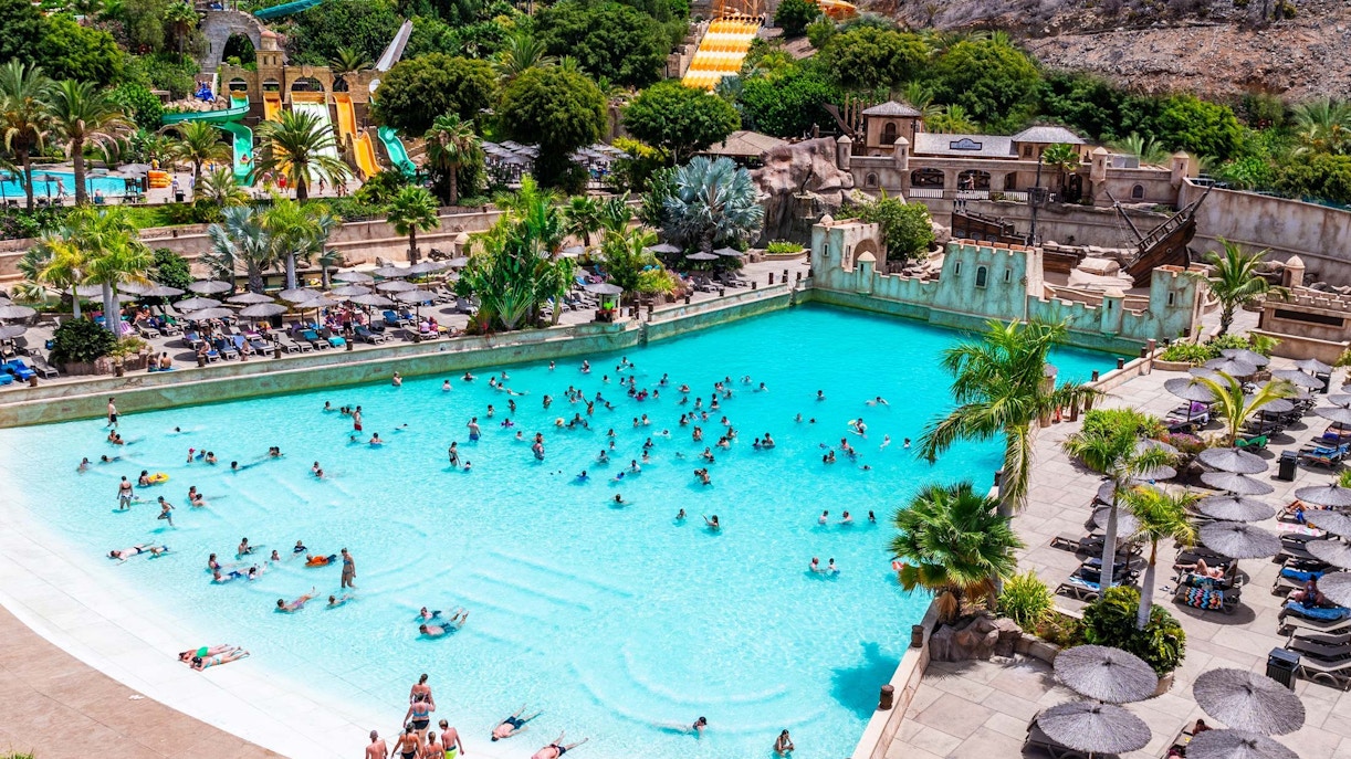 Visitors enjoying the wave pool at Discovery Island, Aqualand Maspalomas.