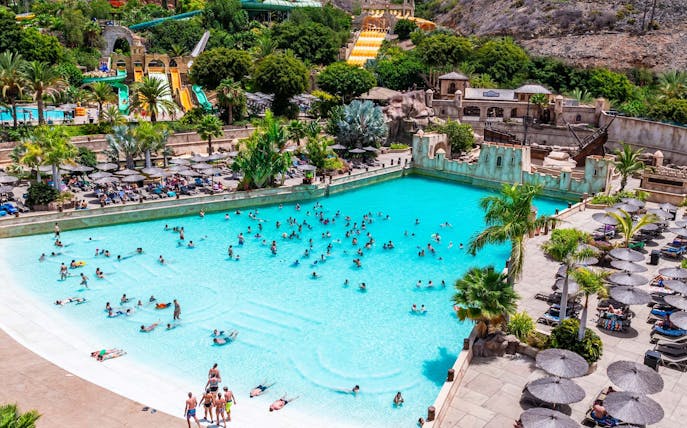 Visitors enjoying the wave pool at Discovery Island, Aqualand Maspalomas.