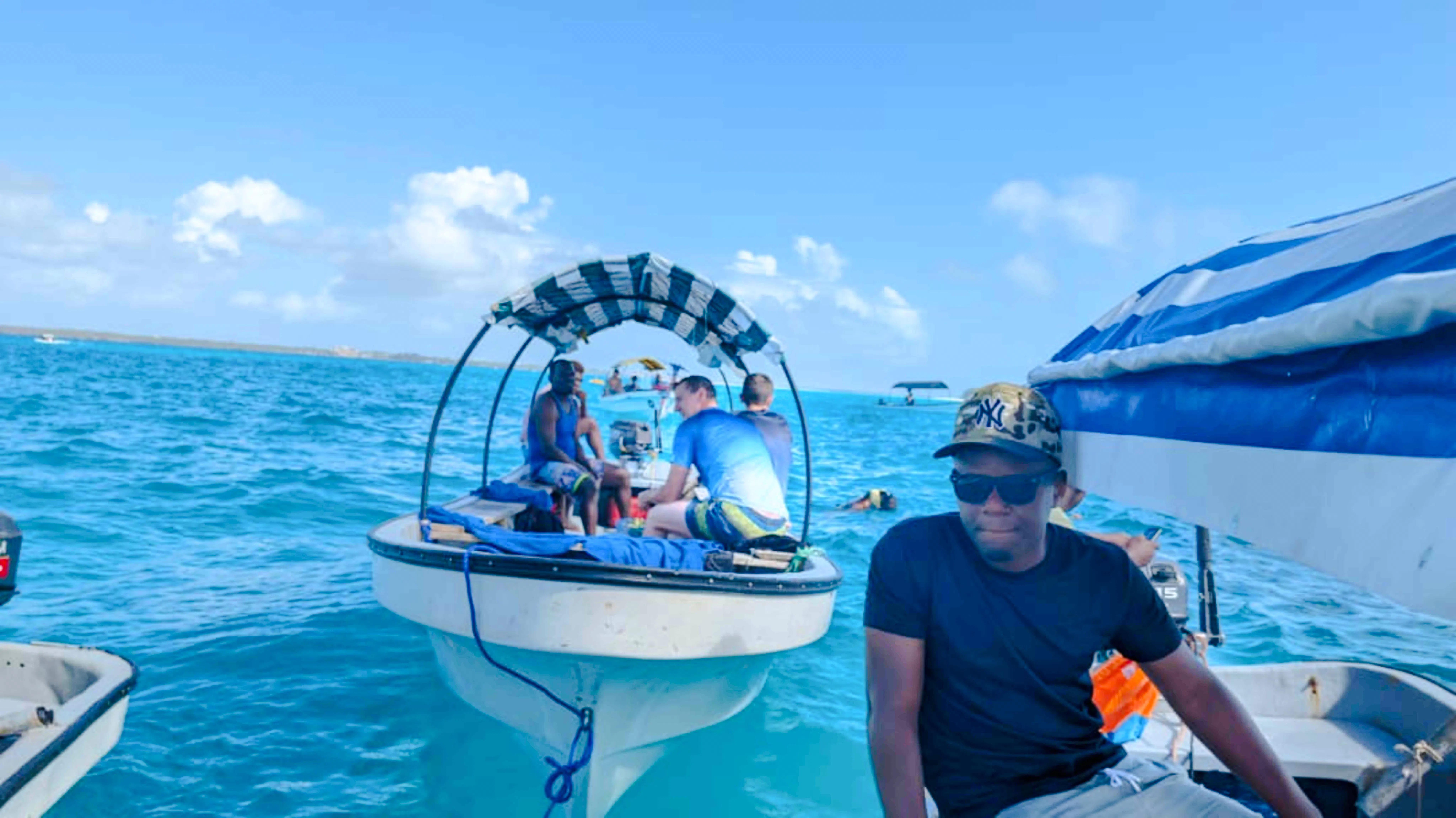 Snorkeling tour group on a boat near Mnemba Island, Zanzibar.