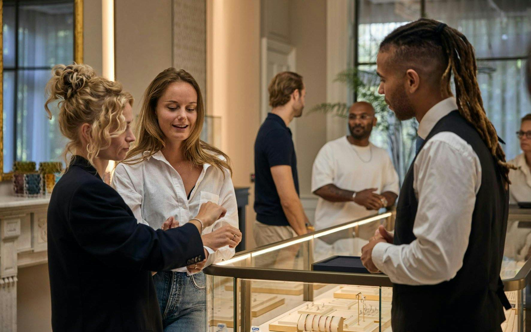 Visitors exploring jewelry at the oldest diamond factory in the world.