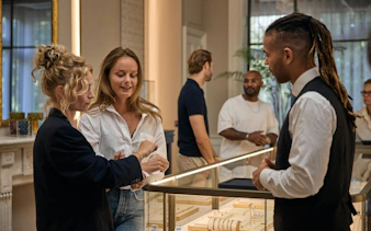 Visitors exploring jewelry at the oldest diamond factory in the world.