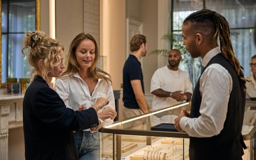 Visitors exploring jewelry at the oldest diamond factory in the world.