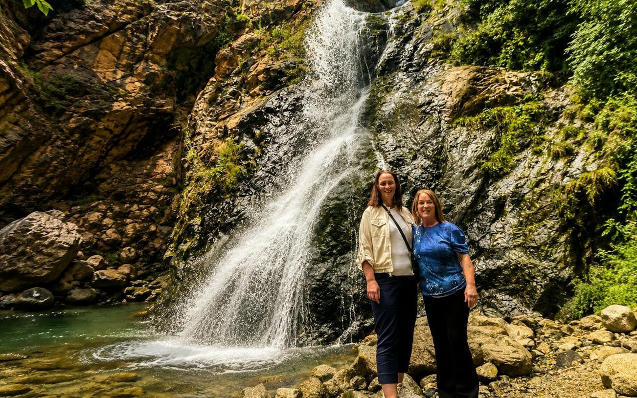 Visitors at a waterfall in Ourika Valley, Atlas Mountains, Marrakech.