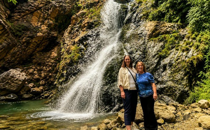 Visitors at a waterfall in Ourika Valley, Atlas Mountains, Marrakech.