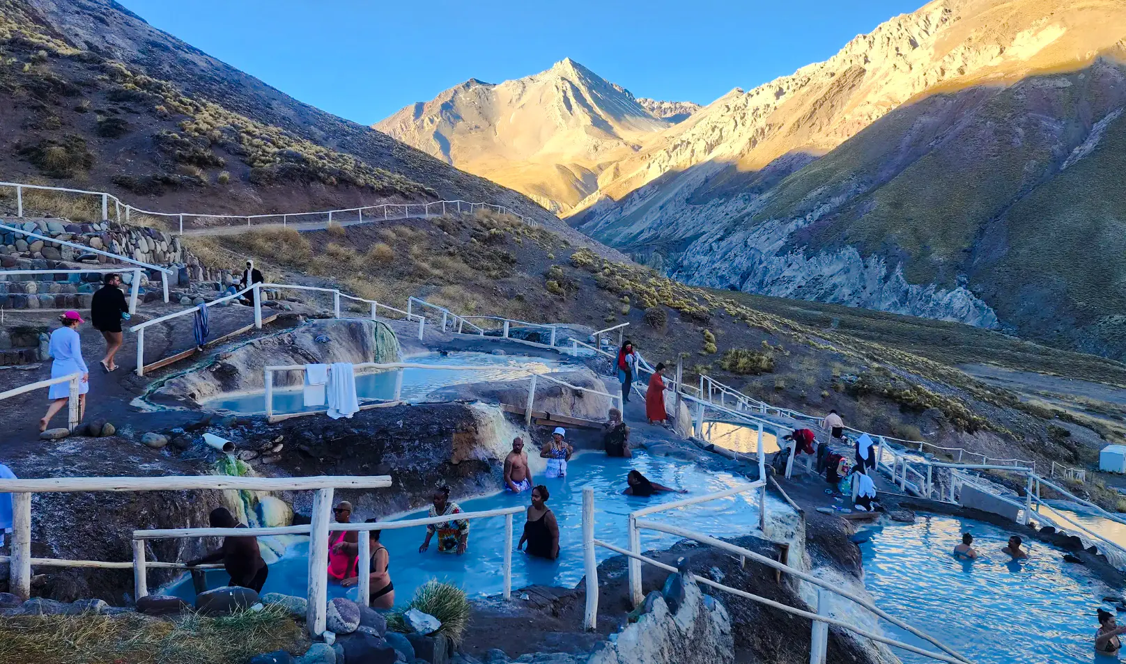 Hot springs at Termas Baños Colina with Andes mountains in Cajon del Maipo, Santiago.