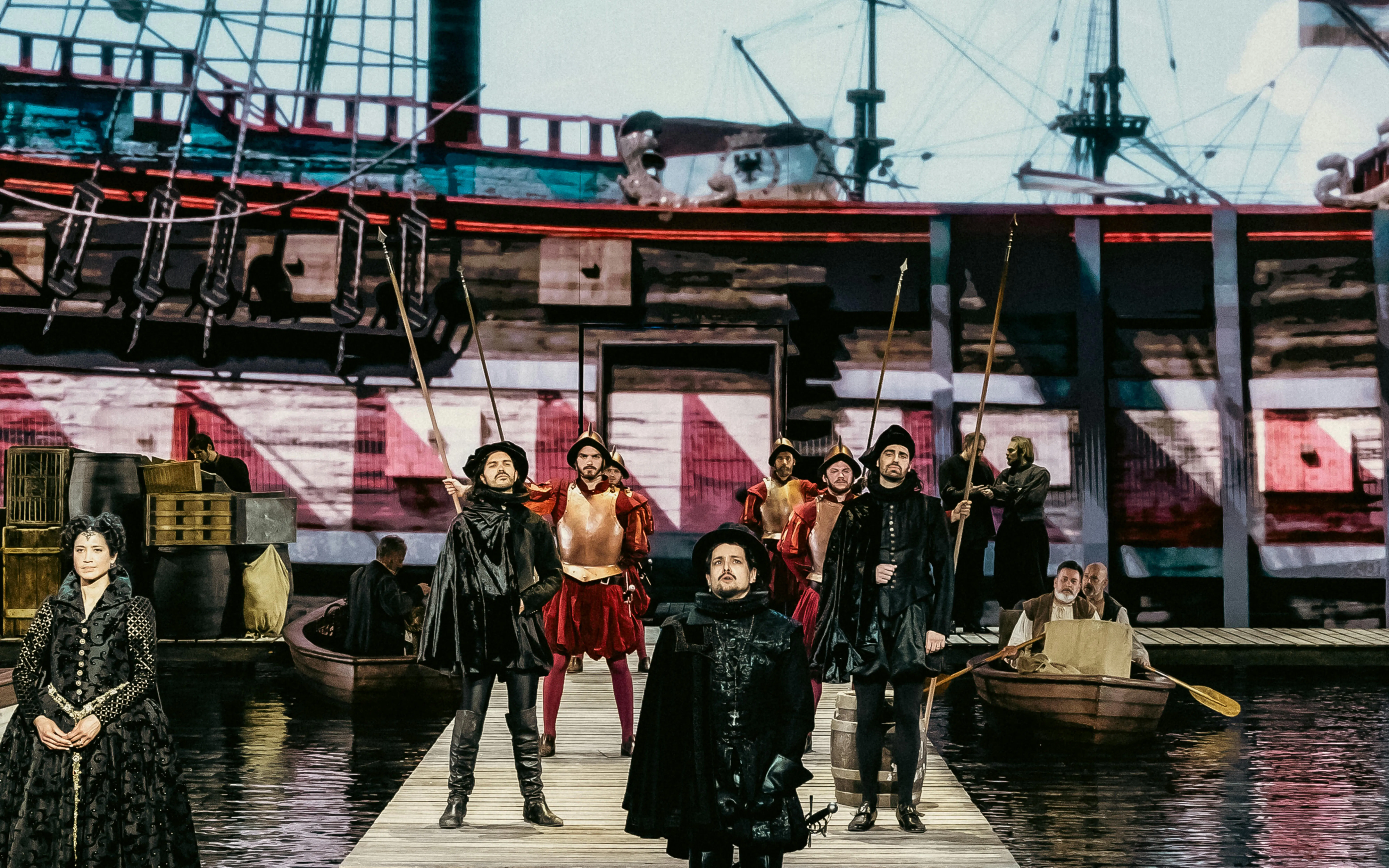 Historical reenactment with actors in period costumes on a dock, ship in the background, Willem van Oranje theme.