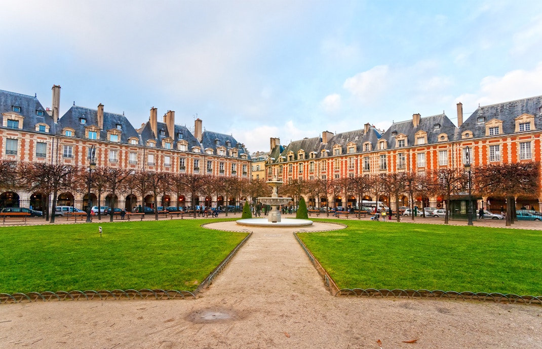 Place des Vosges in Paris with historic architecture and lush gardens.