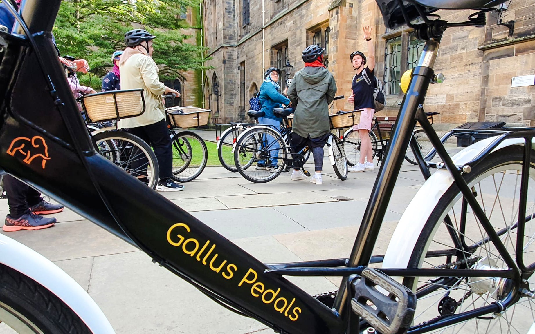 Bikes parked outside a historic building during the Glasgow Highlights Bike Tour.