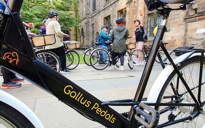 Bikes parked outside a historic building during the Glasgow Highlights Bike Tour.