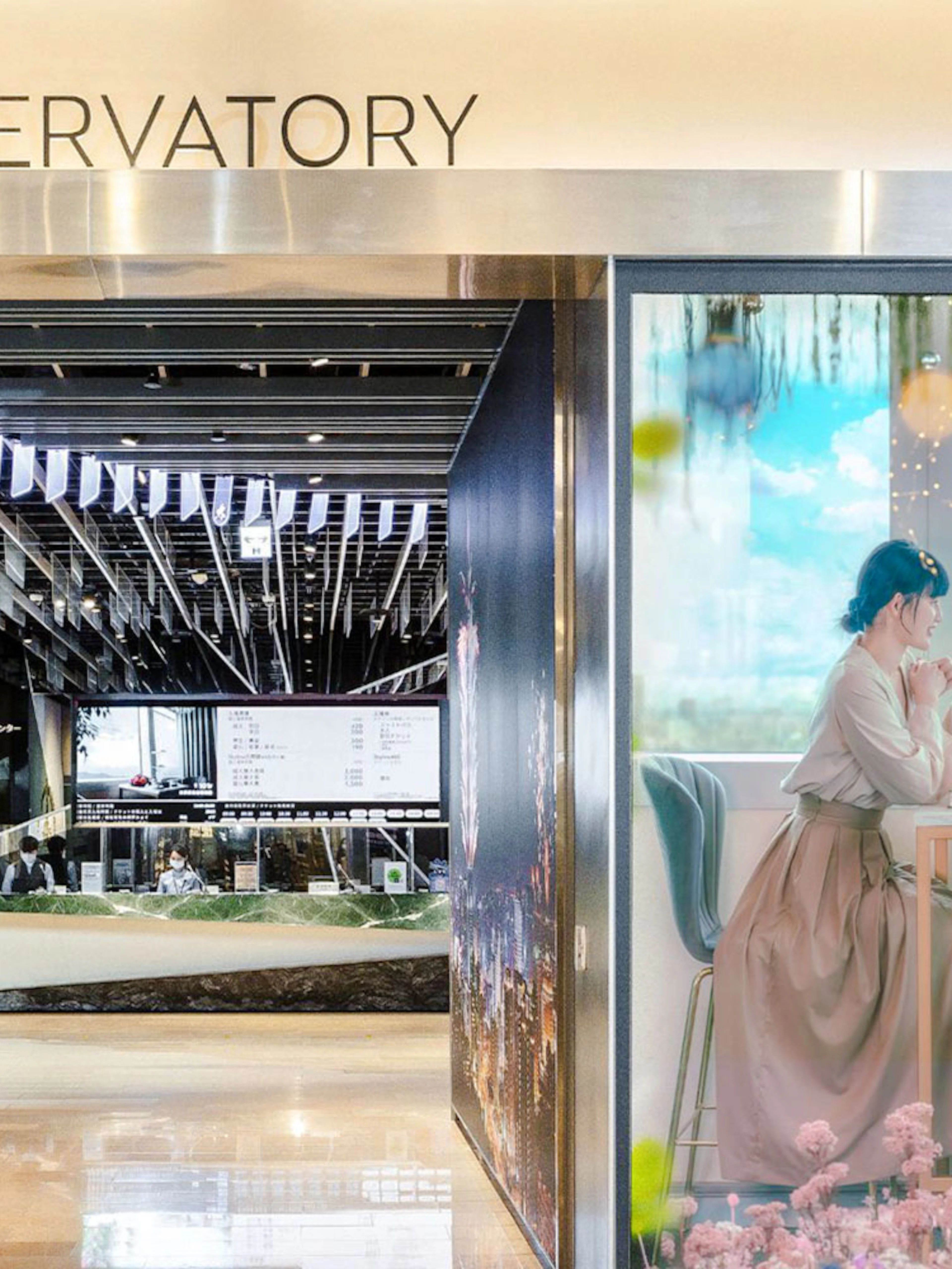 Taipei 101 Observatory entrance with ticket counter and promotional display.