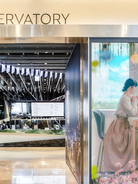 Taipei 101 Observatory entrance with ticket counter and promotional display.