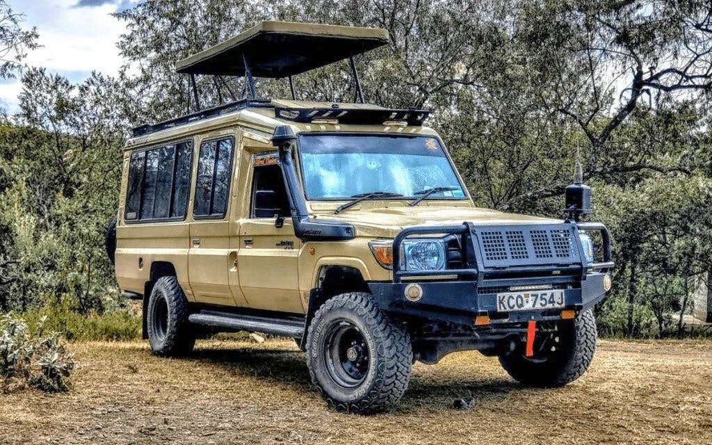 Safari vehicle parked in Nairobi National Park, Kenya.