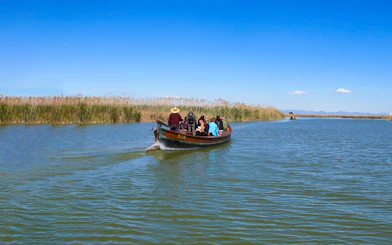 Boat ride through Albufeira Natural Park waterways with passengers enjoying the view.