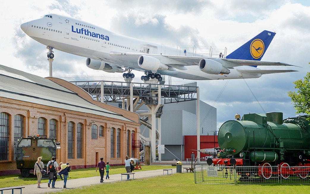 Technik Museum Speyer with Lufthansa plane and vintage train display.