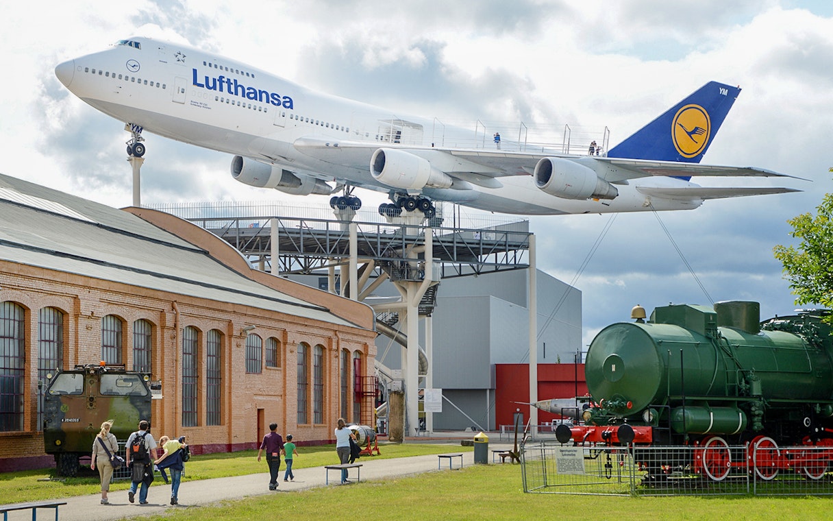 Technik Museum Speyer with Lufthansa plane and vintage train display.