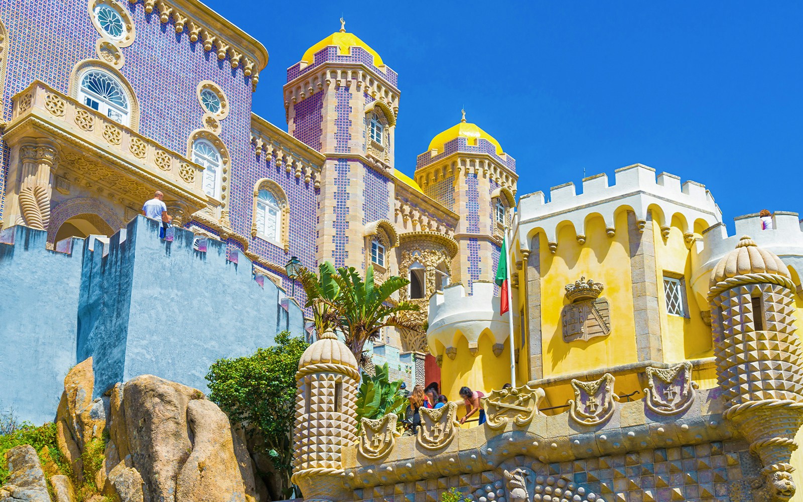 Pena Palace's colorful towers and intricate architecture in Sintra, Lisbon, Portugal.