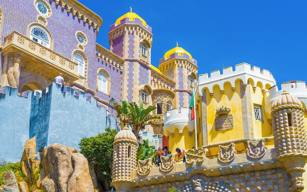 Pena Palace's colorful towers and intricate architecture in Sintra, Lisbon, Portugal.