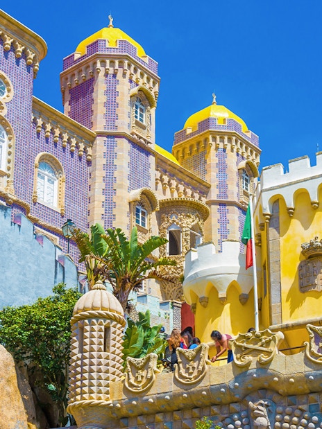 Pena Palace's colorful towers and intricate architecture in Sintra, Lisbon, Portugal.
