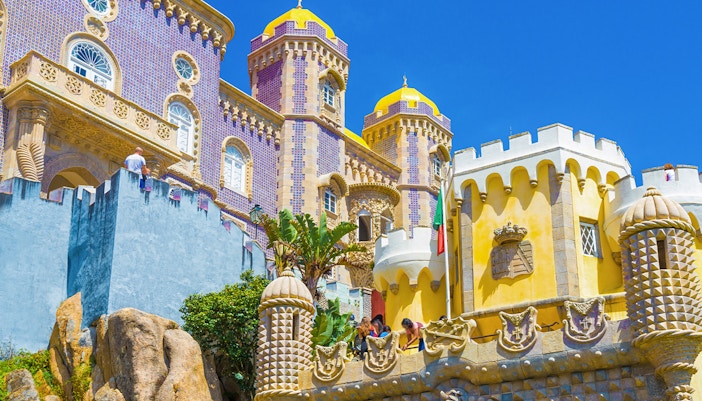 Pena Palace's colorful towers and intricate architecture in Sintra, Lisbon, Portugal.