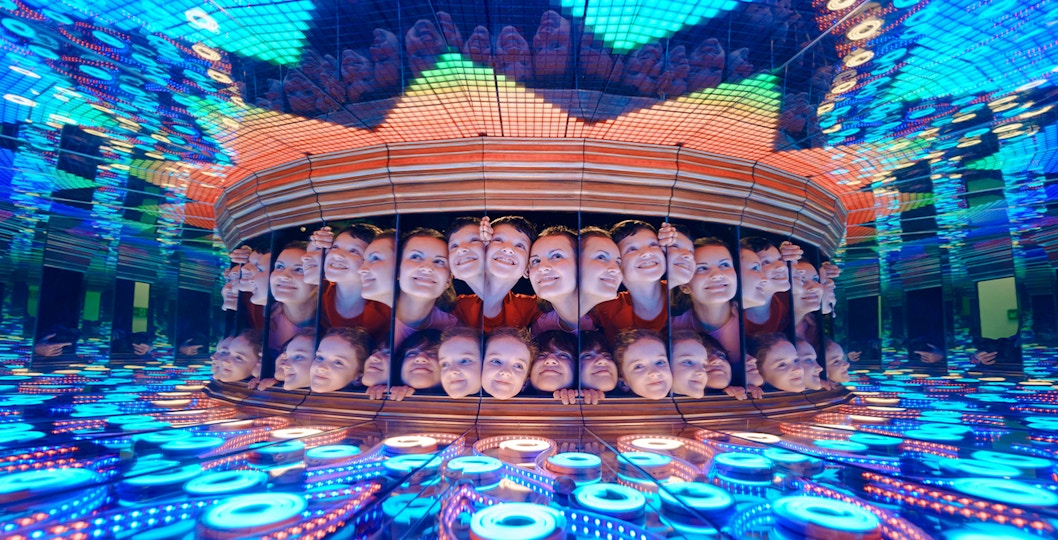 Visitors in the Perpetual Portrait room at Camera Obscura & World of Illusions, Edinburgh.