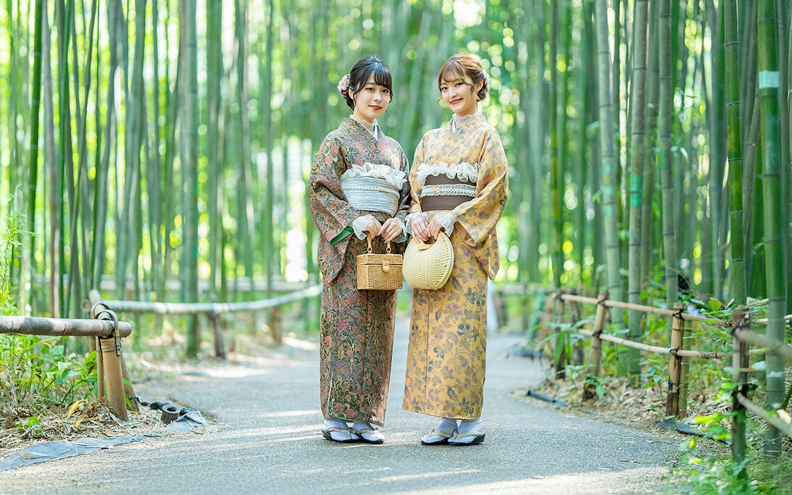 Visitors wearing kimonos in Kyoto's Arashiyama bamboo grove.