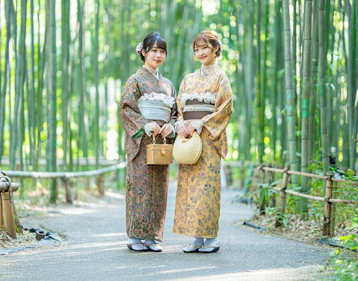 Visitors wearing traditional kimonos in Kyoto's Arashiyama district.