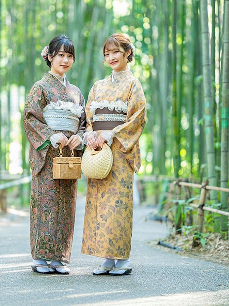 Visitors wearing kimonos in Kyoto's Arashiyama bamboo grove.
