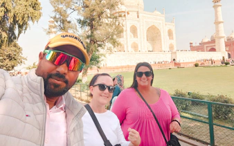 Tourists in front of the Taj Mahal, Agra, during a guided tour from Delhi.